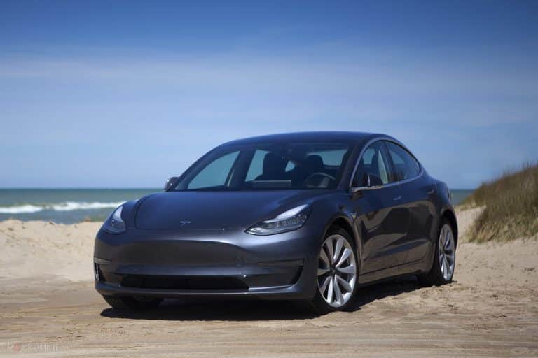 Agitated man destroys Tesla Windshield & Sunroof