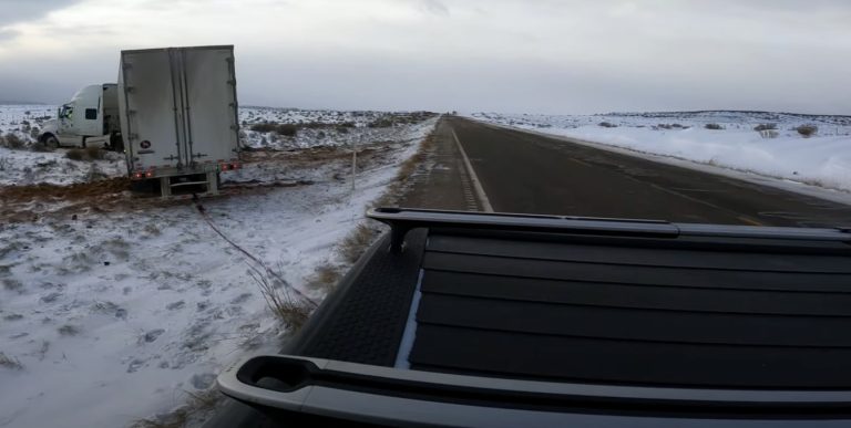 Rivian R1T pulls out stuck 38,000 pound semi and trailer from snowy ditch