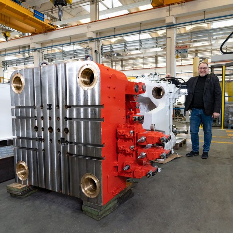 Tesla Giga Press supplier shows dedicated machine for electric motor rotor production — in apparent Tesla colors