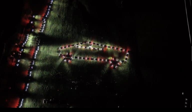 Tesla owners hold stunning Cybertruck-inspired light show