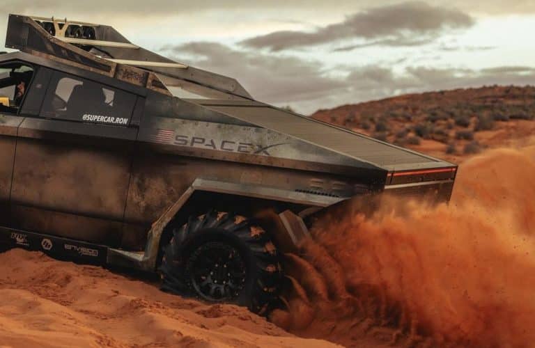 Tesla Cybertruck Challenges Snow Cat in Tug-of-War Showdown